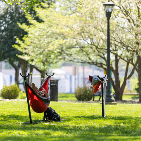 Student in the hammocks on campus